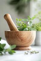 Sunlight filters through leaves, illuminating a rustic wooden mortar and pestle filled with vibrant green herbs photo