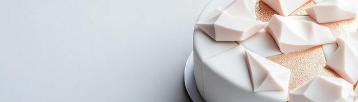 This cake showcases sharp angular fondant textures, enhanced by metallic geometric shapes, making it an ideal centerpiece for modern branding events and celebrations photo