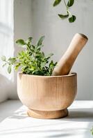 A rustic mortar and pestle is filled with vibrant green herbs, illuminated by soft sunlight filtering through nearby leaves, creating a serene and organic atmosphere photo