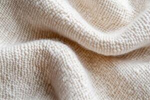 Soft and inviting, the woven wool texture showcases a blend of white and beige fibers, creating an abstract yet warm backdrop ideal for enhancing various interior designs photo
