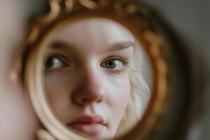 A person stands attentively in front of a mirror, their expression focused while the reflection appears slightly distorted. The ambiance is quiet and mysterious, enhancing the intrigue photo