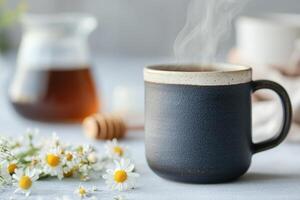 A steaming cup of herbal tea rests in a rustic ceramic mug, surrounded by fresh chamomile flowers and honey, inviting relaxation and a sense of calm in a peaceful setting photo