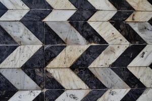 A black and white chevron pattern on a wall photo