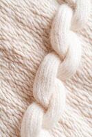 This delightful textile features a warm woven wool texture that combines white and beige fibers, creating an inviting backdrop ideal for cozy spaces. Its abstract pattern adds warmth to any setting photo