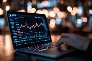 A focused trader analyzes faint glowing market trends on a sleek laptop screen. The background is filled with a vibrant atmosphere, emphasizing the fast-paced investment environment photo