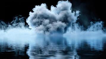 A large cloud of smoke is floating in the water photo