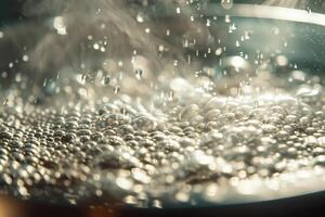 A pot of water boiling with steam rising from it photo