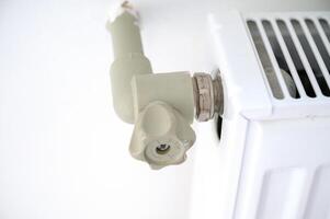 close-up of a plastic valve that fits into the heating system. pipe and radiator with a heating system. photo