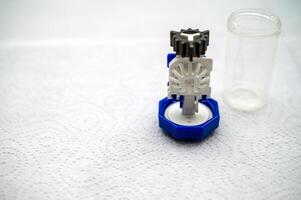 container for cleaning and storing contact lenses for eyes, used at home. For soft and hard lenses. the container consists of two parts, the first part directly for lenses, the second part for liquid photo