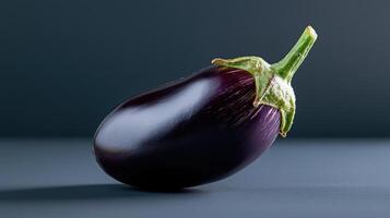 An eggplant is shown on a table photo