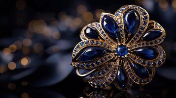 A blue and gold brooch with a flower design photo