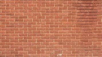 brick wall with a rough texture and classic architectural style. photo