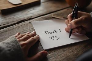 thank you note on a wooden table photo