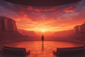 A man stands in front of a large room with a sunset in the background photo