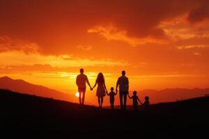 a family walking at sunset in the mountains photo