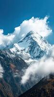 A Grand Snow-Covered Mountain Summit Beneath a Striking Sky photo