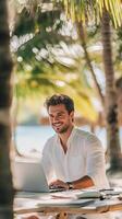 Man Working on Laptop at Beach, Summer Vibes photo
