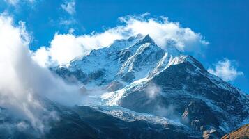 Majestic Snow-Capped Mountain Peaks Under a Vast Blue Sky photo