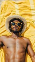 Relaxing Beach Day Man Basking in Sunshine on a Yellow Towel photo