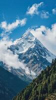 A Majestic, Snow-Draped Mountain Rising Against a Moody Sky photo