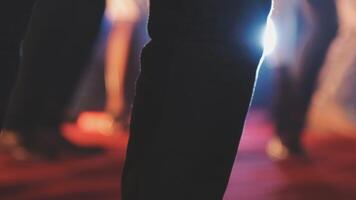 A person standing on a red carpet with their legs spread out video
