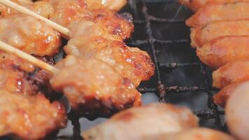 A close up of skewers on a grill video
