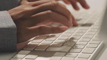 A person is typing on a computer keyboard video