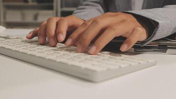 A person typing on a keyboard video