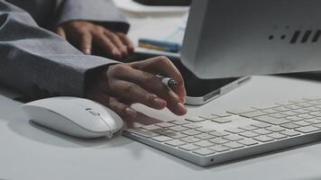 A person typing on a computer keyboard video
