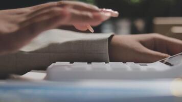 A person using a calculator on a desk video