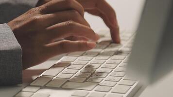 A person typing on a computer keyboard video