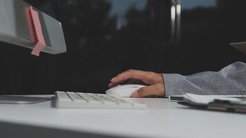 A person is typing on a computer keyboard video