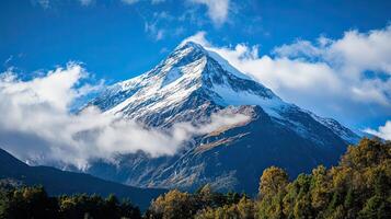 A Breathtaking Snowy Mountain Crest Beneath a Stormy Sky photo