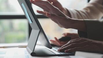 A person is typing on a laptop computer video