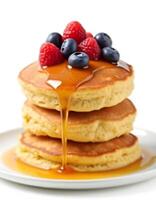 Stack of Pancakes with Berries and Maple Syrup on White Background2 photo