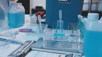 A laboratory table with several bottles and other items video