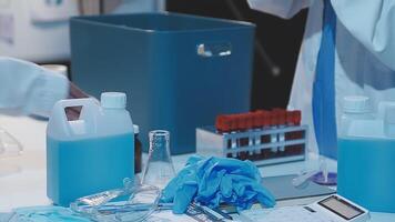 A laboratory table with bottles and other items video