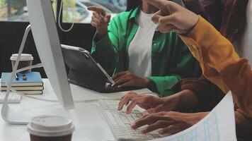 People working on a computer at a desk video