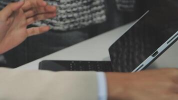 A person is using a laptop computer with their hands video