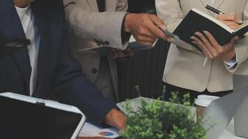 Business people working together at a desk video