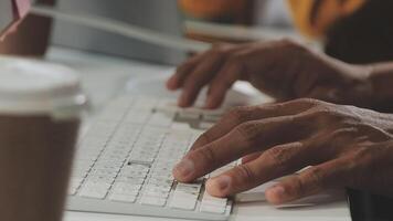 A person typing on a keyboard video