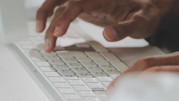 A person typing on a keyboard video