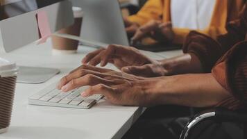 A person typing on a keyboard at a desk video