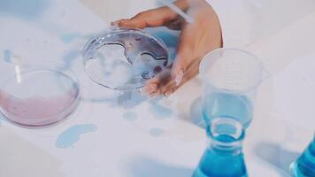 A person is holding a test tube with liquid in it video