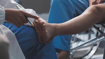 A doctor is examining a patient's foot video