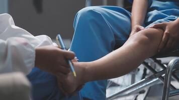 A doctor is examining a patient's leg video