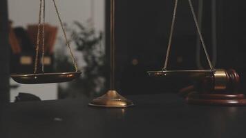 A scale with two gold scales on a desk video