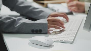 A person typing on a computer keyboard video