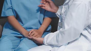 A doctor is talking to a child in a blue suit video