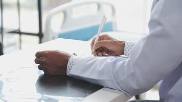 A doctor writing on a piece of paper video